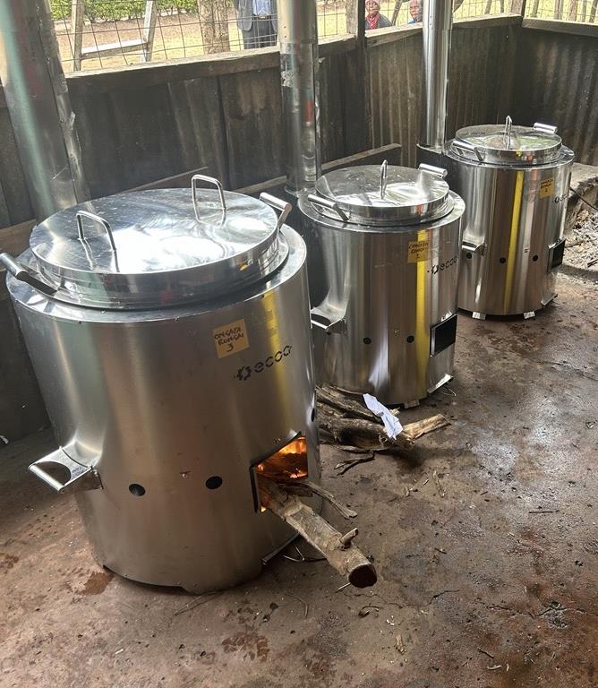 Three stainless steel ECOA Pro stove-pots installed in a school kitchen